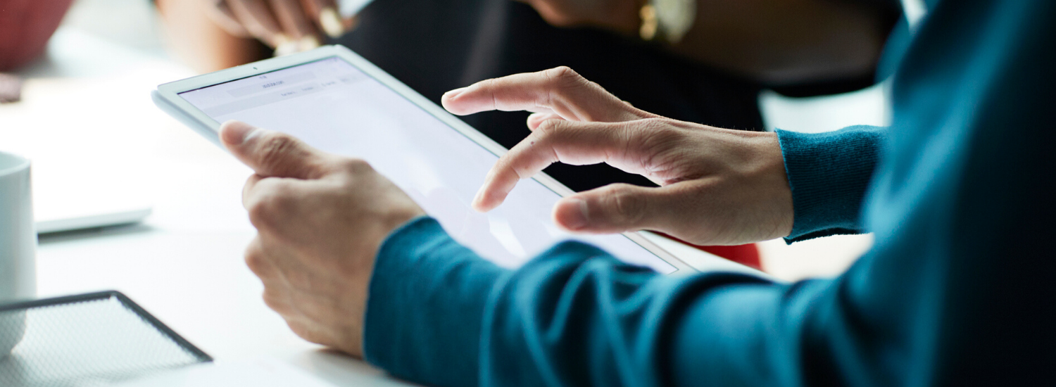 Hands holding a tablet PC